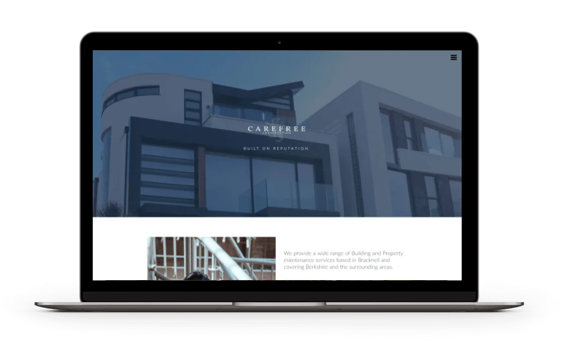 Laptop view of Carefree Construction website, highlighting professional building and property maintenance services.